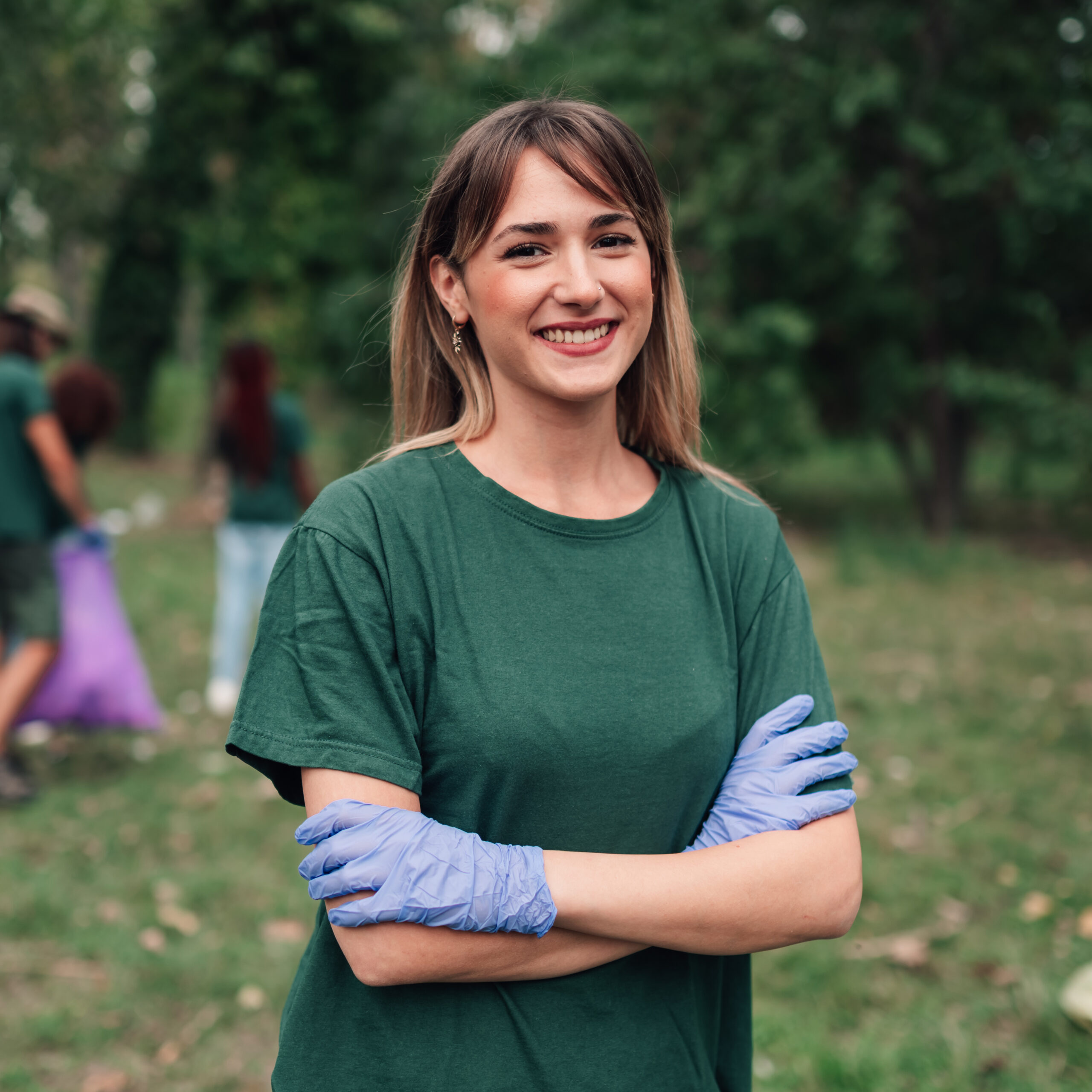 Woman volunteering with environmental clean up team